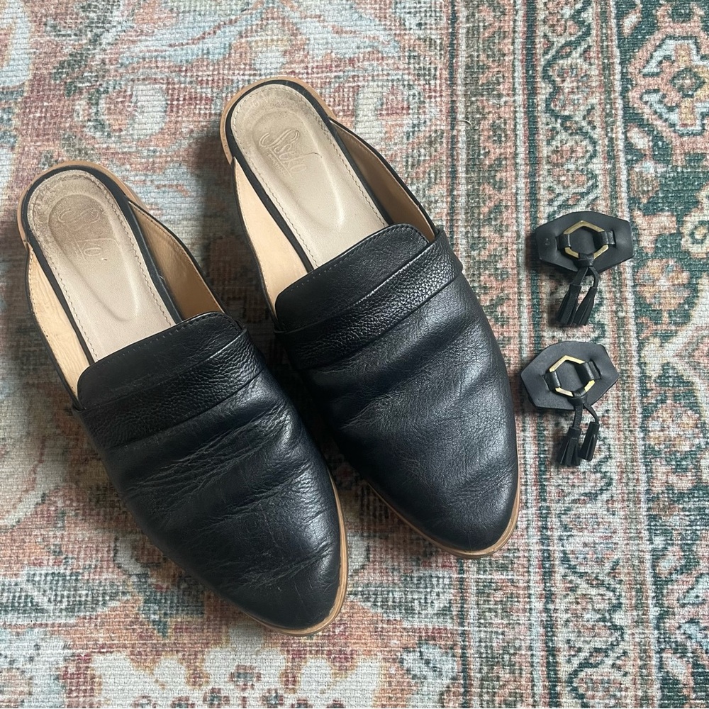 Sseko black leather mules slides with brass charm accessories